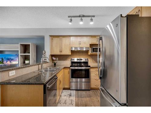 67 Country Village Lane Ne, Calgary, AB - Indoor Photo Showing Kitchen With Stainless Steel Kitchen With Double Sink