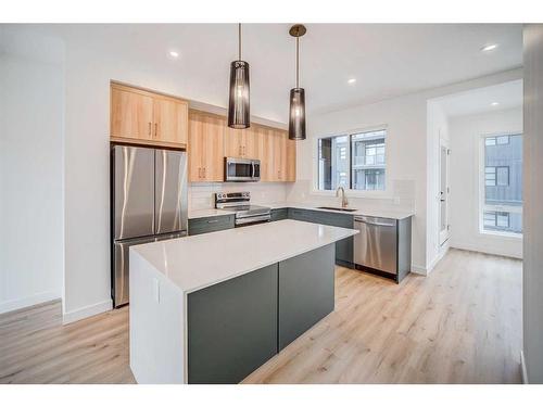 43 Lucas Way Nw, Calgary, AB - Indoor Photo Showing Kitchen With Upgraded Kitchen