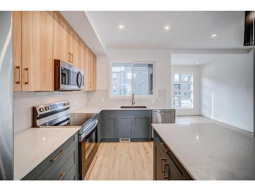 43 Lucas Way Nw, Calgary, AB - Indoor Photo Showing Kitchen With Upgraded Kitchen