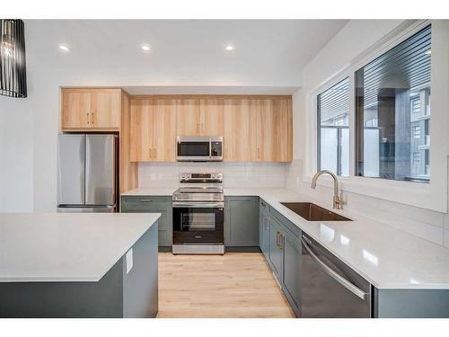 43 Lucas Way Nw, Calgary, AB - Indoor Photo Showing Kitchen With Upgraded Kitchen