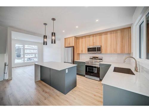 43 Lucas Way Nw, Calgary, AB - Indoor Photo Showing Kitchen With Upgraded Kitchen