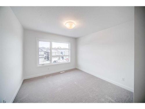 43 Lucas Way Nw, Calgary, AB - Indoor Photo Showing Other Room