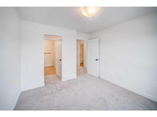 43 Lucas Way Nw, Calgary, AB - Indoor Photo Showing Other Room