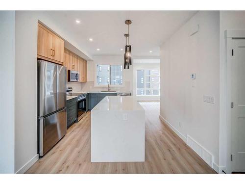 43 Lucas Way Nw, Calgary, AB - Indoor Photo Showing Kitchen With Upgraded Kitchen