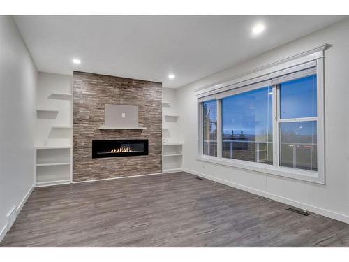 138 Hamptons Heights Nw, Calgary, AB - Indoor With Fireplace