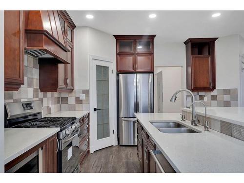 138 Hamptons Heights Nw, Calgary, AB - Indoor Photo Showing Kitchen With Stainless Steel Kitchen With Double Sink With Upgraded Kitchen