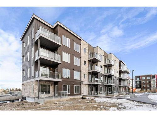 405-660 Shawnee Square Sw, Calgary, AB - Outdoor With Balcony With Facade