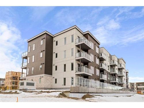 405-660 Shawnee Square Sw, Calgary, AB - Outdoor With Balcony With Facade