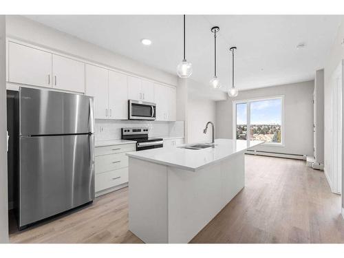 405-660 Shawnee Square Sw, Calgary, AB - Indoor Photo Showing Kitchen With Upgraded Kitchen