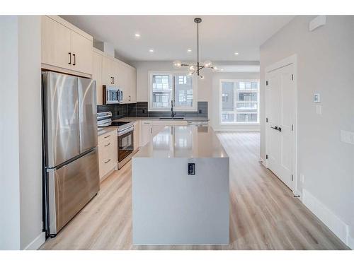 37 Lucas Way Nw, Calgary, AB - Indoor Photo Showing Kitchen With Upgraded Kitchen