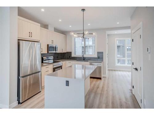 37 Lucas Way Nw, Calgary, AB - Indoor Photo Showing Kitchen With Upgraded Kitchen