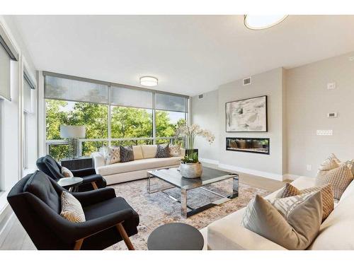 110-15 Cougar Ridge Landing Sw, Calgary, AB - Indoor Photo Showing Living Room