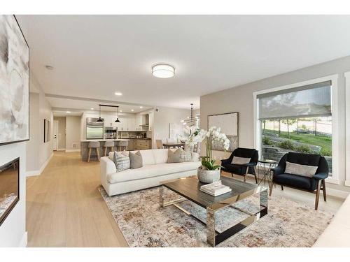 110-15 Cougar Ridge Landing Sw, Calgary, AB - Indoor Photo Showing Living Room