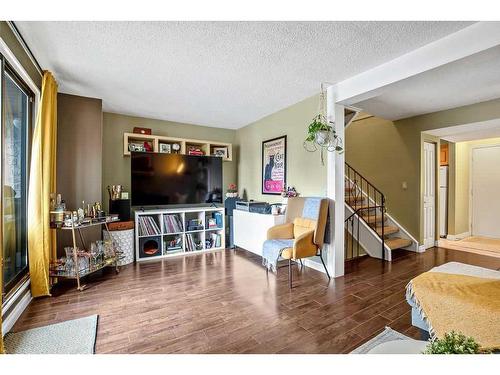 703-2520 Palliser Drive Sw, Calgary, AB - Indoor Photo Showing Living Room