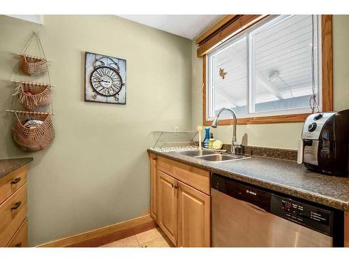 703-2520 Palliser Drive Sw, Calgary, AB - Indoor Photo Showing Kitchen With Double Sink