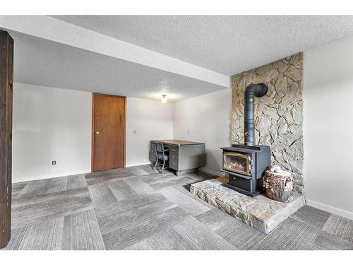 12 Glenport Road, Cochrane, AB - Indoor Photo Showing Living Room With Fireplace