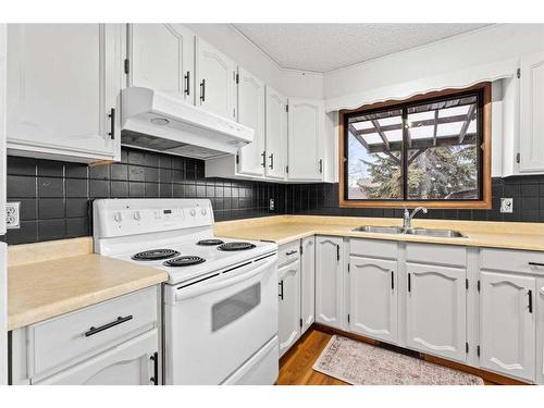 12 Glenport Road, Cochrane, AB - Indoor Photo Showing Kitchen With Double Sink