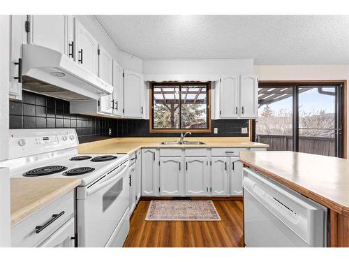 12 Glenport Road, Cochrane, AB - Indoor Photo Showing Kitchen With Double Sink