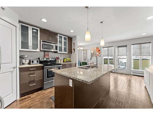 302-4704 Stanley Road Sw, Calgary, AB - Indoor Photo Showing Kitchen With Double Sink With Upgraded Kitchen