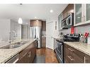 302-4704 Stanley Road Sw, Calgary, AB  - Indoor Photo Showing Kitchen With Double Sink With Upgraded Kitchen 