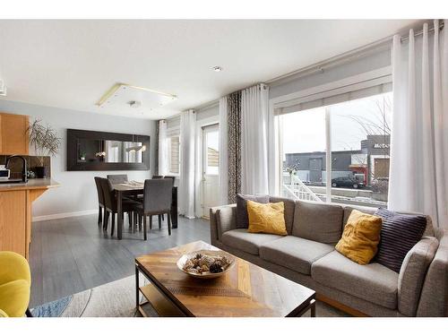 106-800 Yankee Valley Boulevard Se, Airdrie, AB - Indoor Photo Showing Living Room