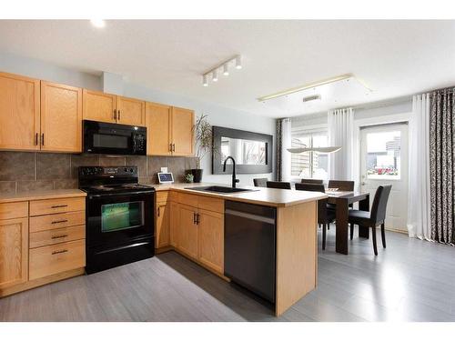 106-800 Yankee Valley Boulevard Se, Airdrie, AB - Indoor Photo Showing Kitchen