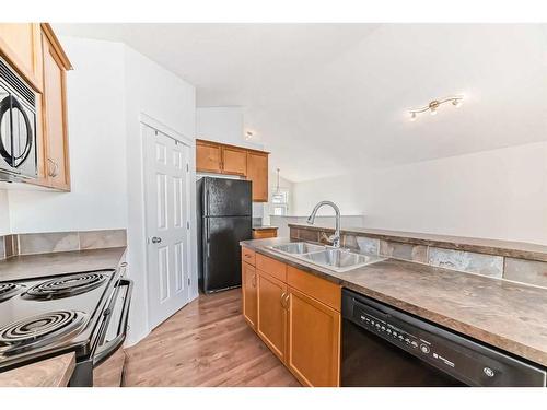 442 Sagewood Drive Sw, Airdrie, AB - Indoor Photo Showing Kitchen With Double Sink