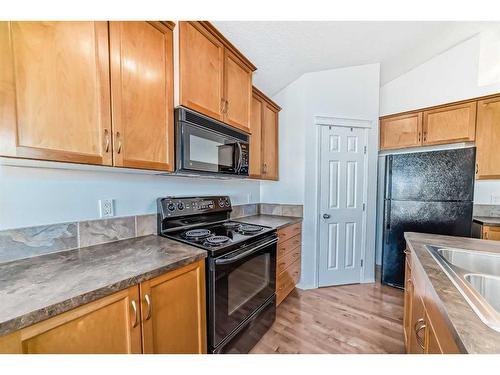 442 Sagewood Drive Sw, Airdrie, AB - Indoor Photo Showing Kitchen With Double Sink