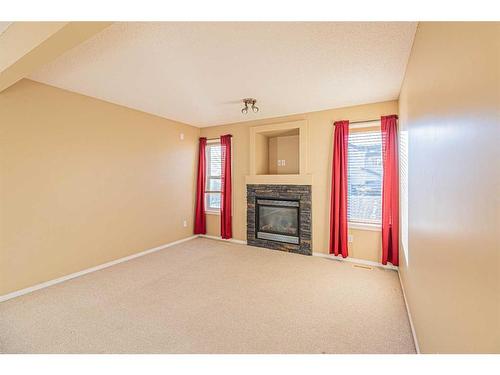 47 Everoak Gardens Sw, Calgary, AB - Indoor Photo Showing Living Room With Fireplace