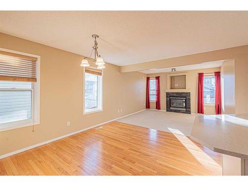 47 Everoak Gardens Sw, Calgary, AB - Indoor Photo Showing Other Room With Fireplace