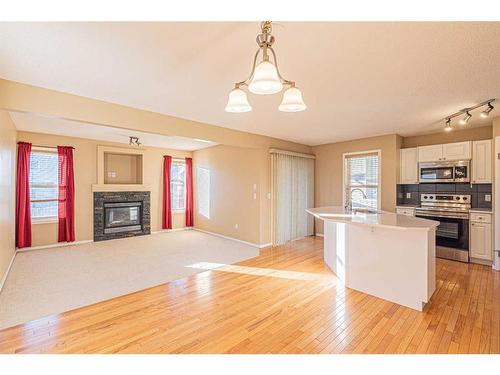 47 Everoak Gardens Sw, Calgary, AB - Indoor Photo Showing Kitchen With Fireplace