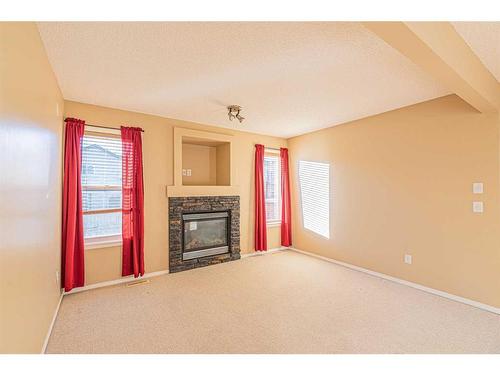 47 Everoak Gardens Sw, Calgary, AB - Indoor Photo Showing Living Room With Fireplace