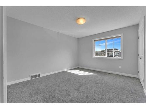 109 Kinniburgh Cove, Chestermere, AB - Indoor Photo Showing Other Room