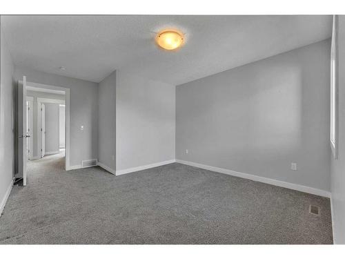 109 Kinniburgh Cove, Chestermere, AB - Indoor Photo Showing Other Room