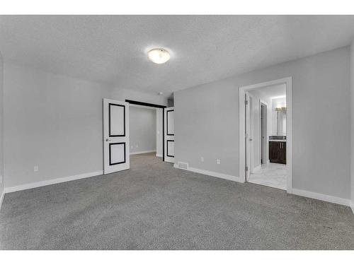 109 Kinniburgh Cove, Chestermere, AB - Indoor Photo Showing Other Room