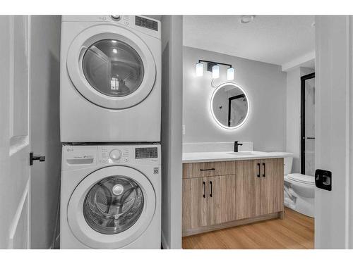 109 Kinniburgh Cove, Chestermere, AB - Indoor Photo Showing Laundry Room