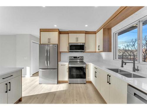 5516 5 Avenue Se, Calgary, AB - Indoor Photo Showing Kitchen With Double Sink With Upgraded Kitchen