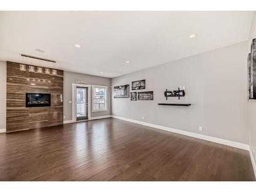 222 Ravenscroft Green Se, Airdrie, AB - Indoor Photo Showing Living Room With Fireplace