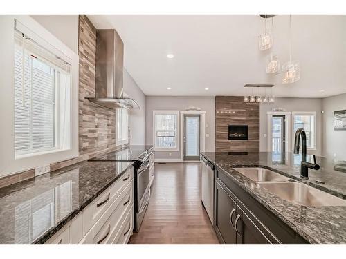 222 Ravenscroft Green Se, Airdrie, AB - Indoor Photo Showing Kitchen With Double Sink With Upgraded Kitchen