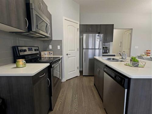 705-250 Sage Valley Road Nw, Calgary, AB - Indoor Photo Showing Kitchen With Stainless Steel Kitchen With Double Sink