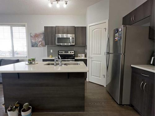 705-250 Sage Valley Road Nw, Calgary, AB - Indoor Photo Showing Kitchen With Stainless Steel Kitchen With Double Sink With Upgraded Kitchen