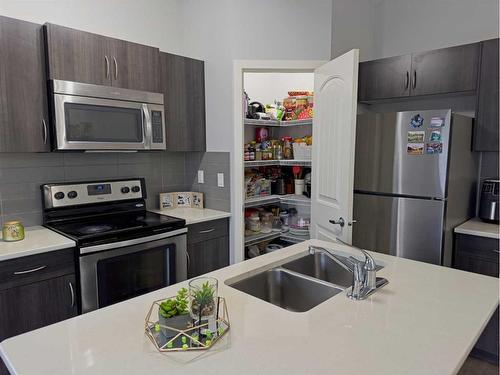 705-250 Sage Valley Road Nw, Calgary, AB - Indoor Photo Showing Kitchen With Stainless Steel Kitchen With Double Sink With Upgraded Kitchen