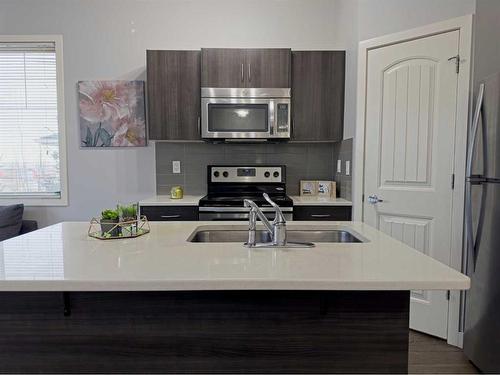 705-250 Sage Valley Road Nw, Calgary, AB - Indoor Photo Showing Kitchen With Stainless Steel Kitchen With Double Sink With Upgraded Kitchen