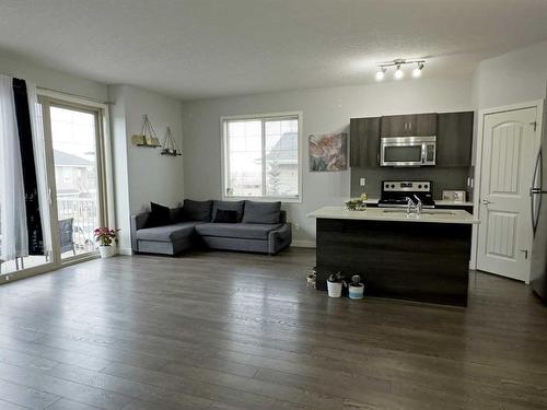 705-250 Sage Valley Road Nw, Calgary, AB - Indoor Photo Showing Living Room