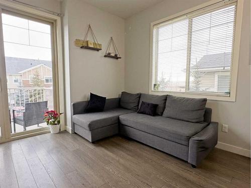 705-250 Sage Valley Road Nw, Calgary, AB - Indoor Photo Showing Living Room