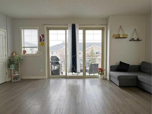 705-250 Sage Valley Road Nw, Calgary, AB - Indoor Photo Showing Living Room