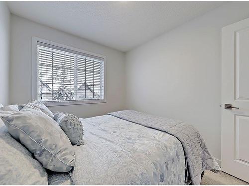 149 Rockyspring Grove Nw, Calgary, AB - Indoor Photo Showing Bedroom