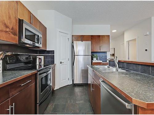 149 Rockyspring Grove Nw, Calgary, AB - Indoor Photo Showing Kitchen With Double Sink