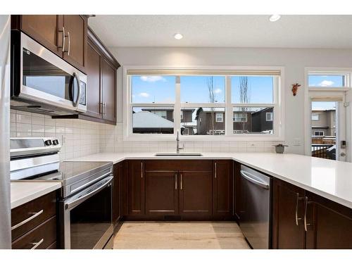 333 Clydesdale Way, Cochrane, AB - Indoor Photo Showing Kitchen With Upgraded Kitchen