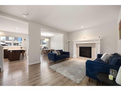 333 Clydesdale Way, Cochrane, AB - Indoor Photo Showing Living Room With Fireplace